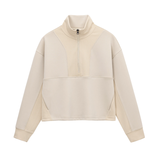 Front view of Grace Fairhope Boxy Quarter Zip in ivory showing ribbed collar, quarter zip and kangaroo pocket