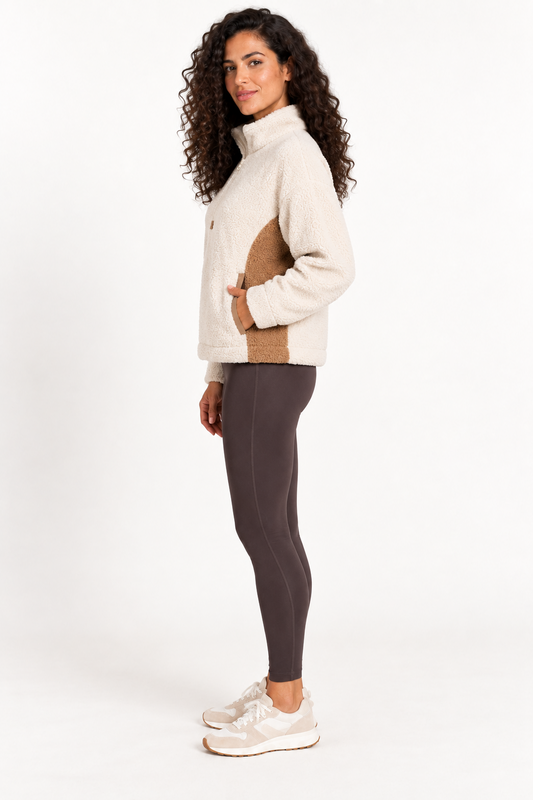 Woman wearing the Grace Point Clear Sherpa Boxy Pullover in Bone White, side view
