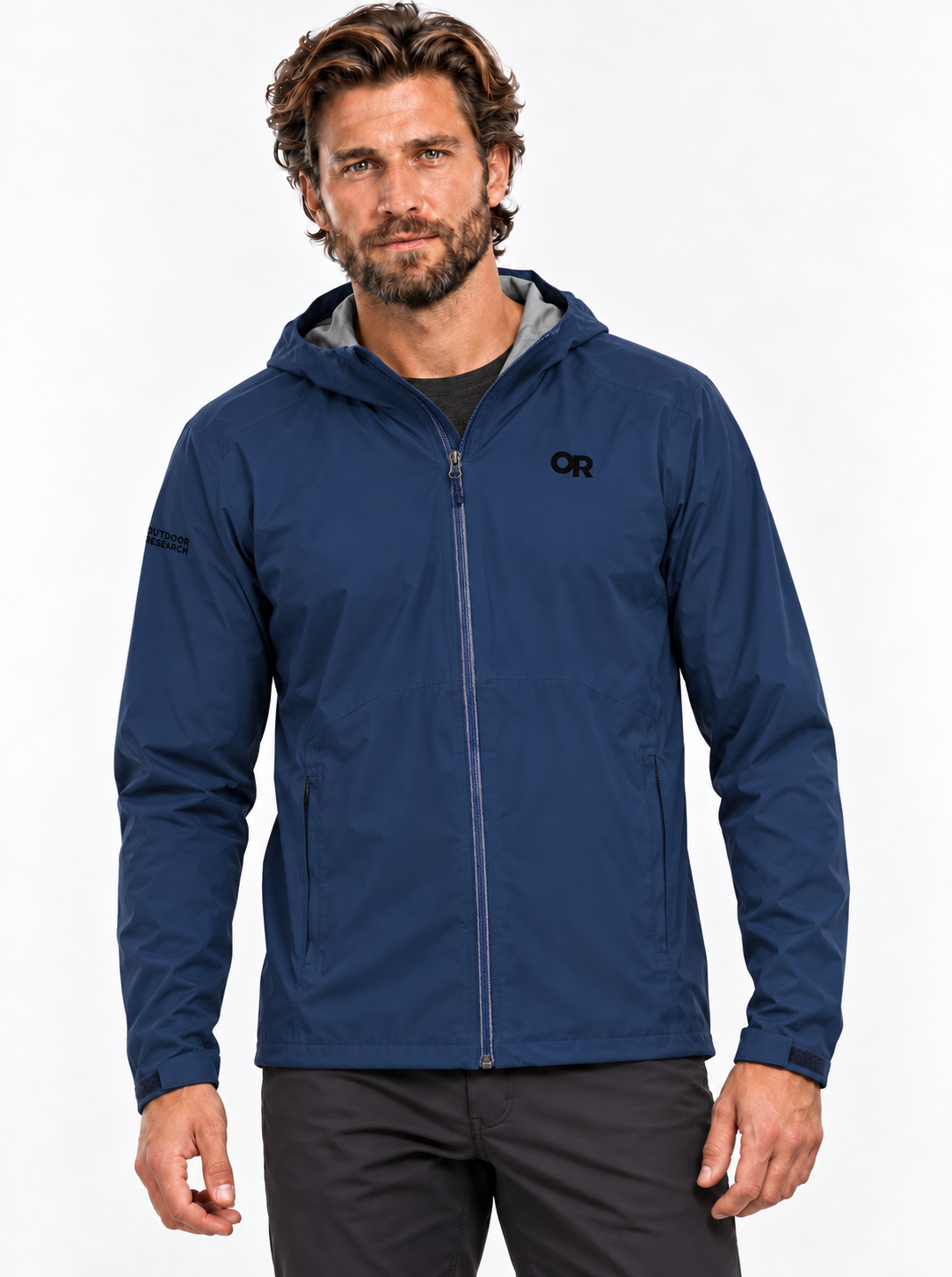 RBO model wearing the Outdoor Research men's Stratoburst Stretch Rain Jacket in Solid Cenote