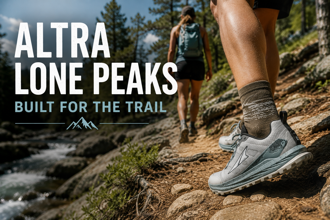 Two hikers wearing Altra Lone Peak trail running shoes on a rocky forest trail beside a stream, highlighting the shoes in an outdoor hiking environment.