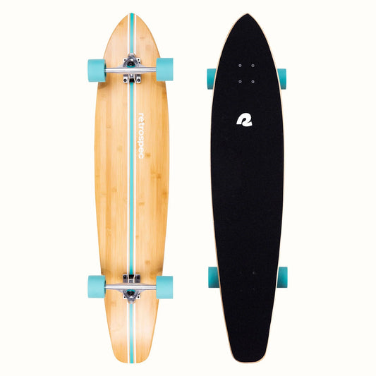 Two longboards, one wooden and one black, on a white background
