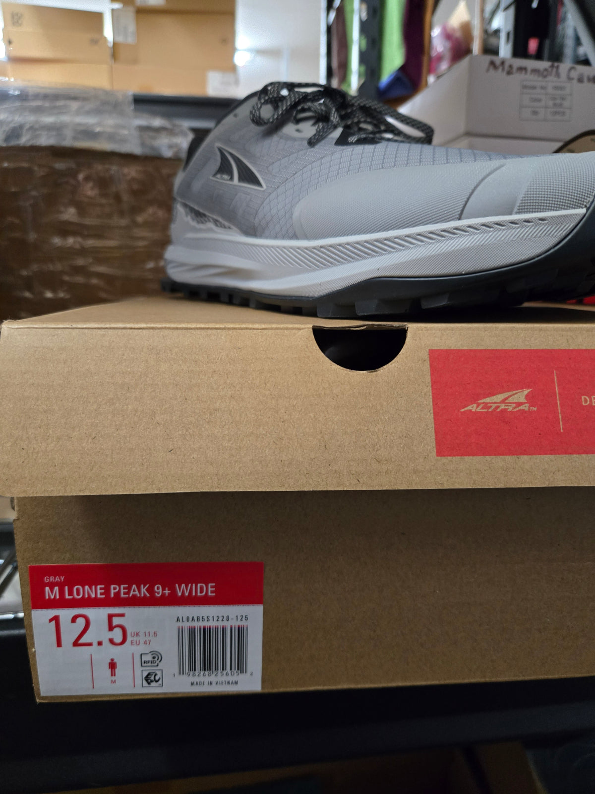 Actual men's Altra Lone Peak 9+ Wide in Gray, US size 12.5, with matching box label