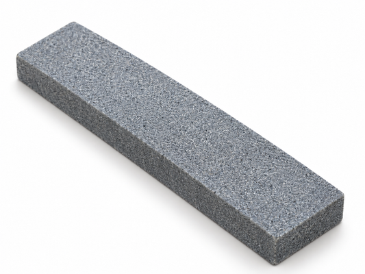 Gray rectangular Bear Paw sharpening stone shown from an angle with its plain abrasive face visible