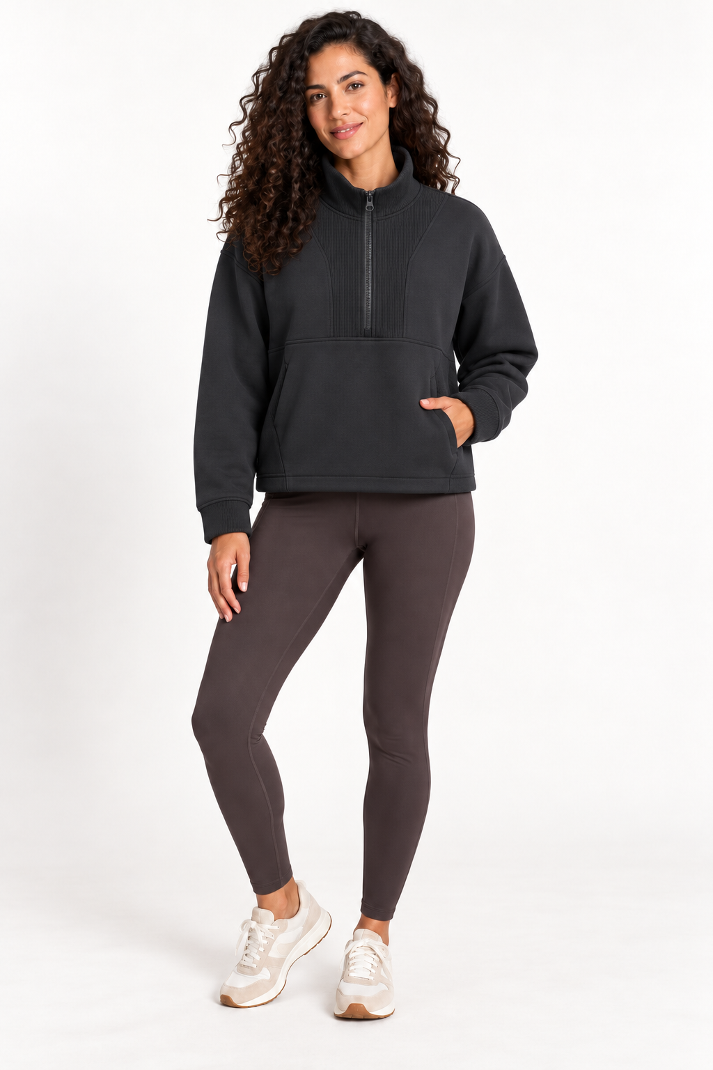 Model wearing the Grace Fairhope Boxy Quarter Zip in Black with leggings and sneakers