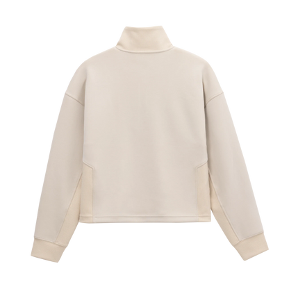 Back view of Grace Fairhope Boxy Quarter Zip in ivory showing the stand collar, dropped shoulders and ribbed side panels