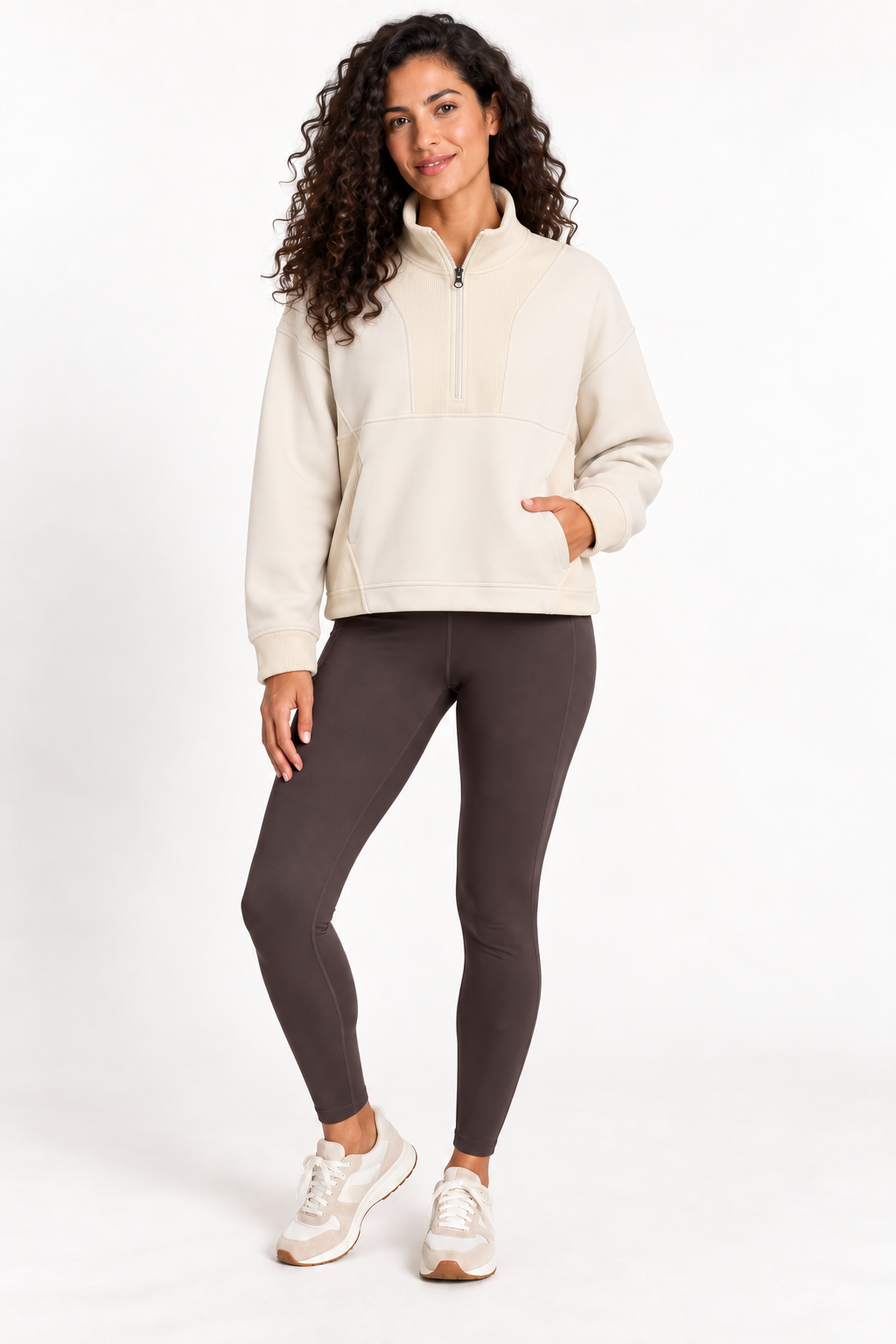 Model wearing the Grace Fairhope Boxy Quarter Zip in ivory with leggings and sneakers