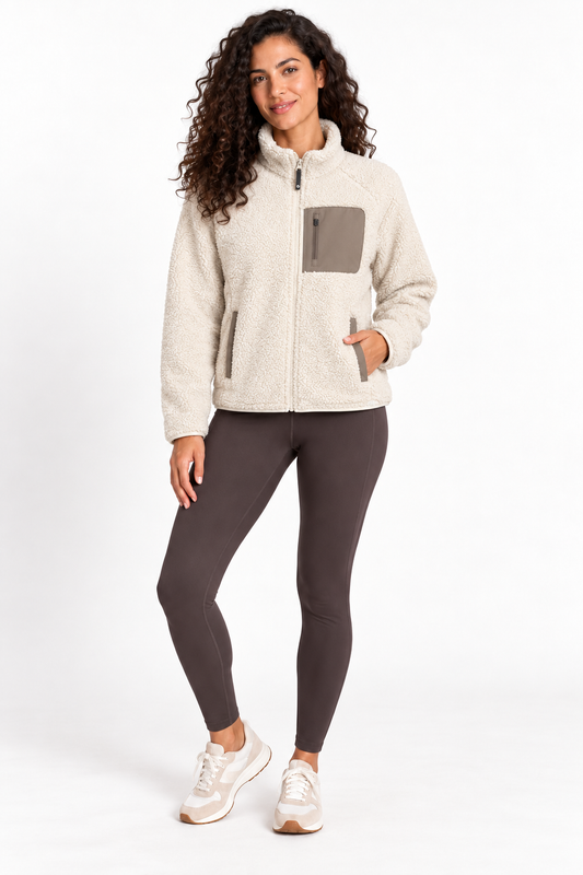 Front view of a model wearing the Grace Mobile Bay Sherpa Jacket in Bone White with a taupe chest pocket and two lower pockets
