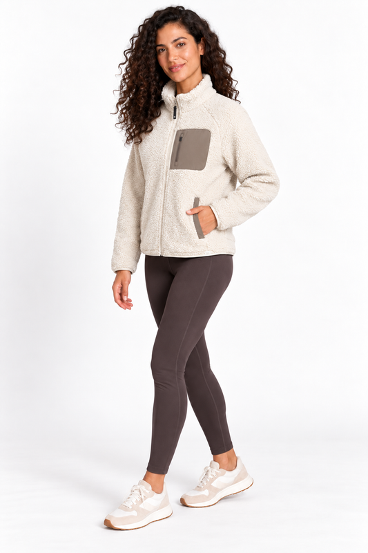 Three-quarter view of a model wearing the Grace Mobile Bay Sherpa Jacket in Bone White