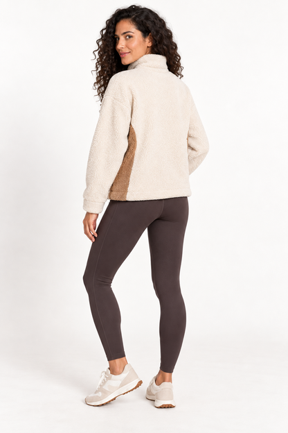 Woman wearing the Grace Point Clear Sherpa Boxy Pullover in Bone White, back view