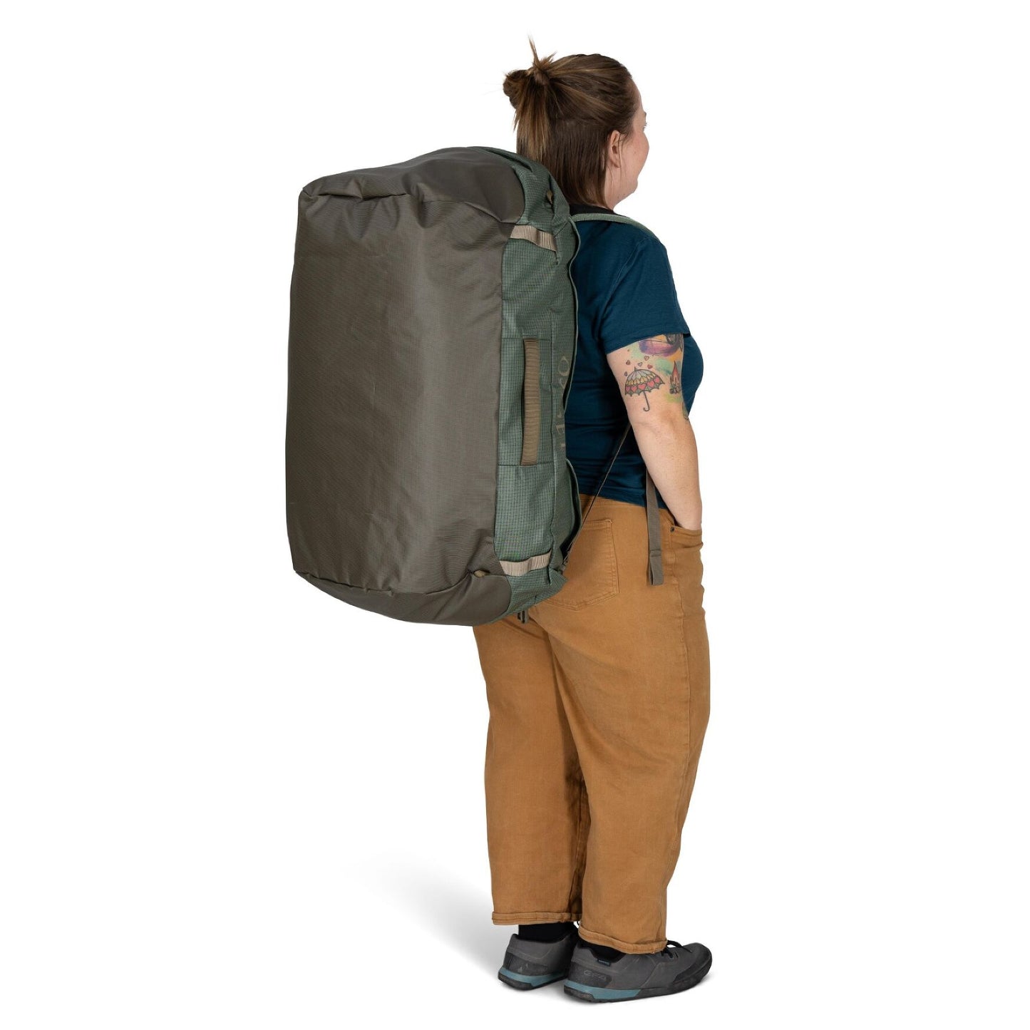 Osprey Transporter Duffel 95 in Pine Leaf Earl Grey worn as backpack by woman