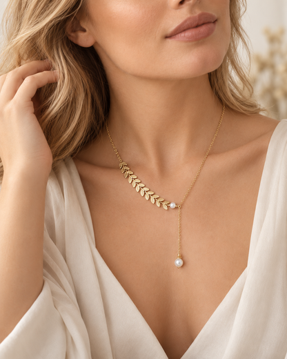 Willow + Wren gold leaf and pearl necklace worn with a white blouse